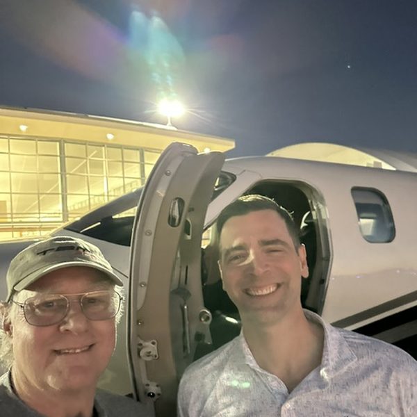 Dr. Ryan Ahern with airplane (optional testimonial photo)